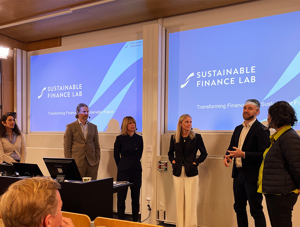 Women and men in a panel discussion.