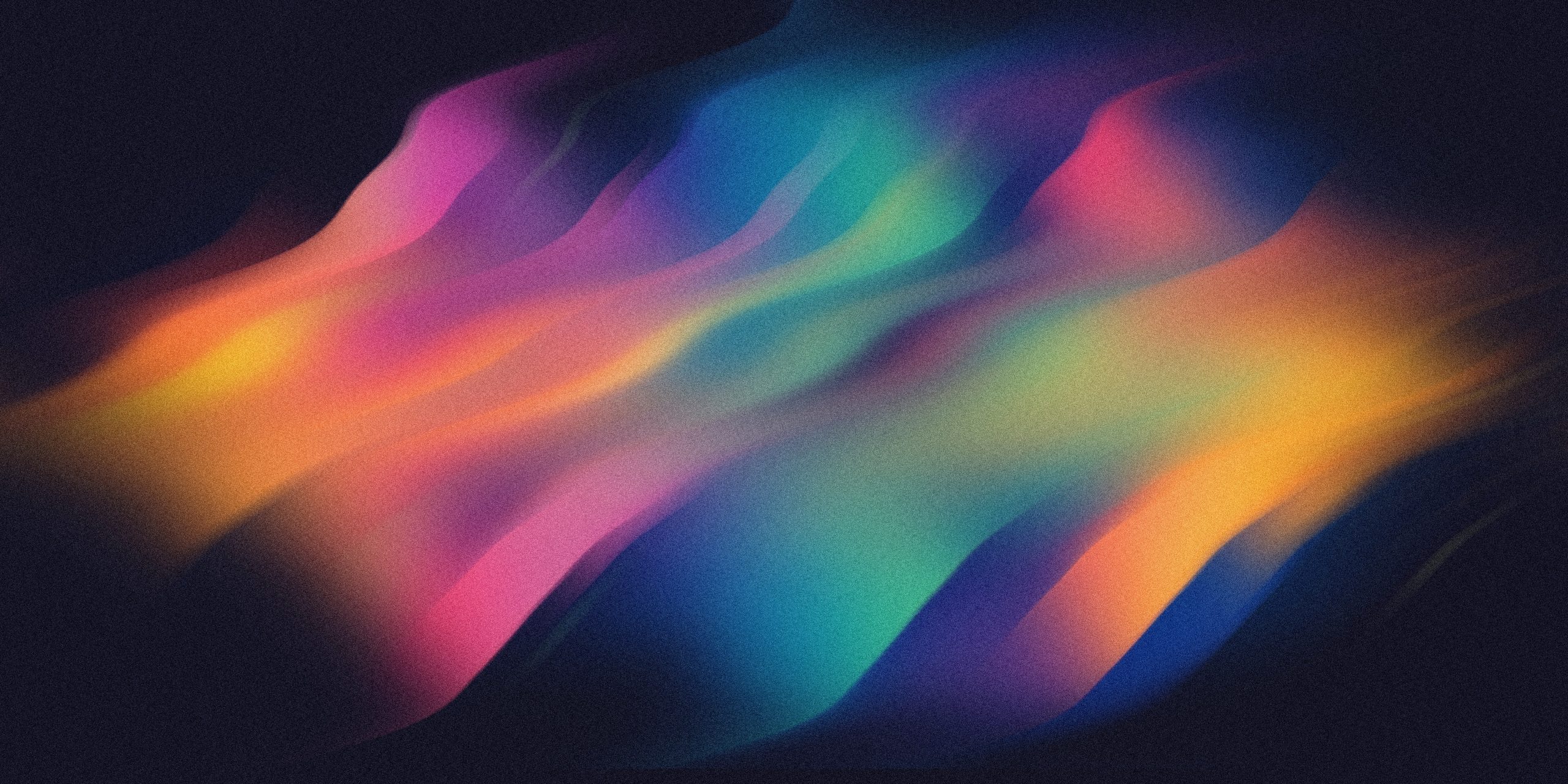 A dynamic abstract design featuring smooth, colorful gradient waves flowing across a dark background, creating a futuristic and artistic visual effect.